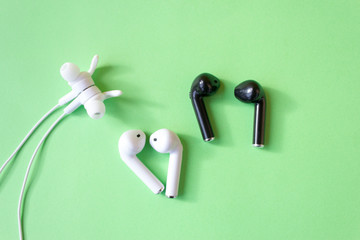Black and white wireless headphones. Gadget and technology concept with copy space.