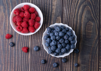 Berries, summer fruits on a wooden table. Healthy lifestyle concept. Selective focus
