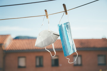 Protective masks hanging in the sun for disinfection