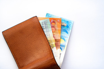 New wallet with money on a white background. European Banknotes in a open wallet.