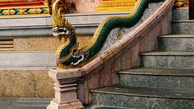Traditional Thai temple snake like decoration at entrance to the temple in Phuket, Thailand.
