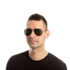 Headshot of a young man wearing aviator sunglasses, isolated on white