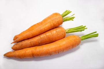 Close up view of whole pieces of carrots isolated on a white background. No people