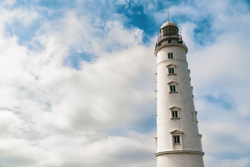 Lighthouse on a background of blue sky