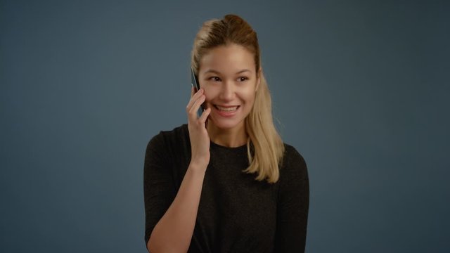 Young Woman Gets Good News on Phone