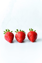 Berries of ripe strawberries on a white background