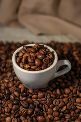 Fragrant coffee beans. Coffee in a cup. Fragrant drink.