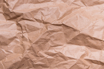 Brown crumpled packaging paper textured background