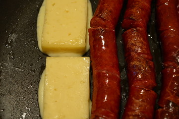 sausage and cheese  on a grill