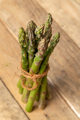 asparagus tied in a bunch placed on the table