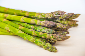 Fresh asparagus on wooden surface