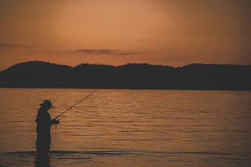 fishing at sunset