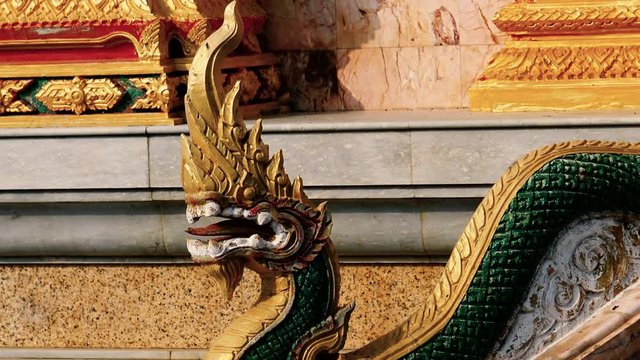 Traditional Thai temple snake like decoration at entrance to the temple in Phuket, Thailand.