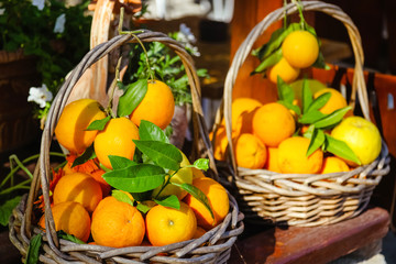 Close-up of two baskets of oranges