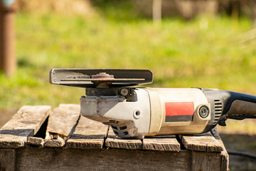 Metal processing with a manual electric grinder.