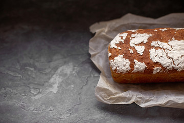Fragrant and crunchy bread on parchment in the kitchen. Homemade fresh bread without yeast.
