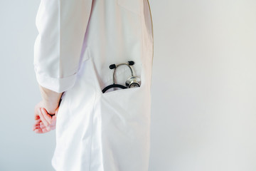 The doctor is holding a phonendoscope.