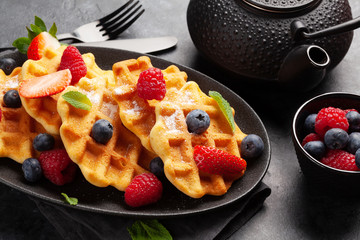 Delicious belgian waffles with summer berries
