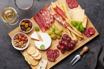 Cheese, meat, grapes and olives antipasto