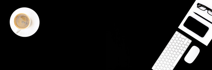 Office supplies on black background.