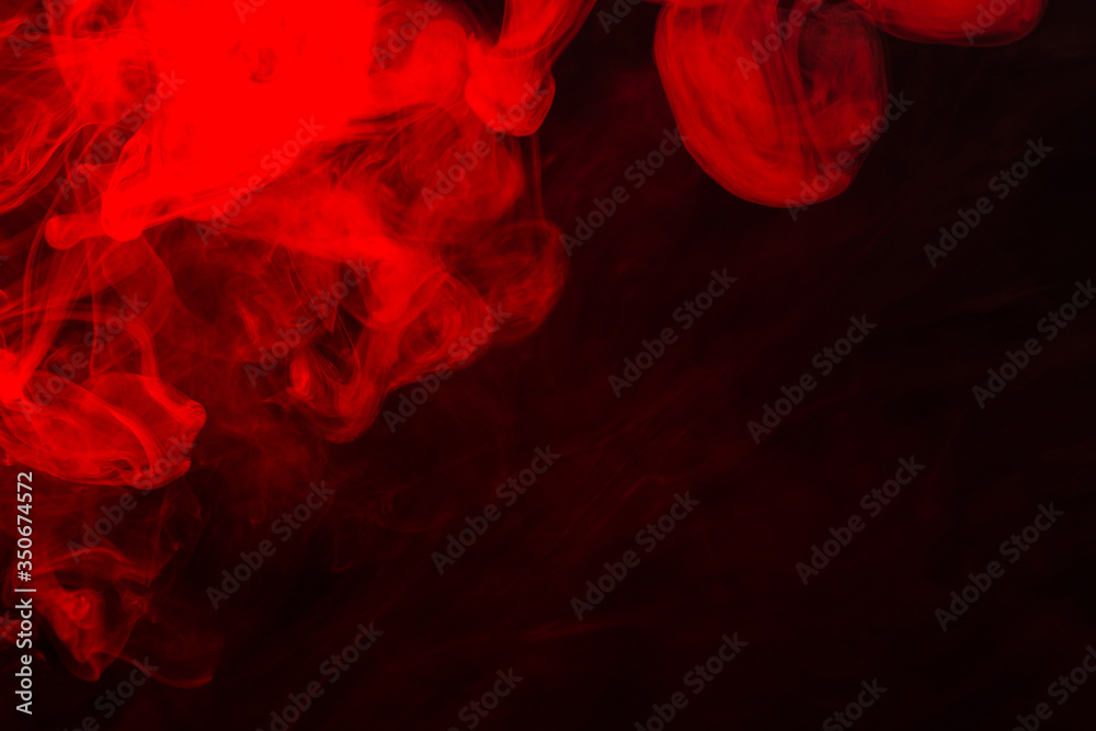 Wall mural red steam on a black background.