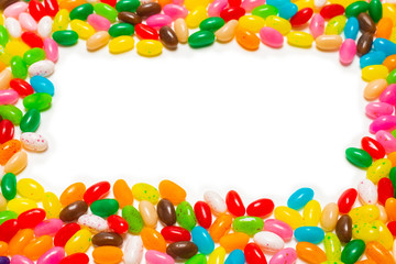 Colorful jelly beans isolated on white. Top view.