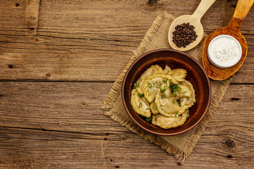 Dumplings stuffed stewed cabbage and sour cream. Traditional Ukrainian dish varenyky