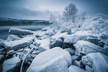 Frosty stones on the shore of Lake Babinskaya Imandra in the Arctic