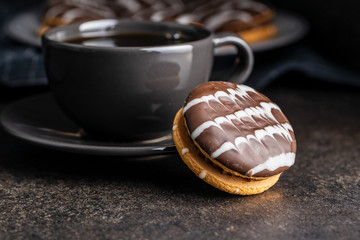 Sweet dessert with chocolate cream and chocolate icing