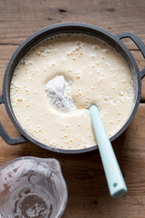 Preparing sponge batter , mixing flour 