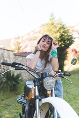Fototapeta na wymiar woman having a good time in a motorbike