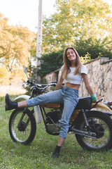 Fototapeta na wymiar woman having a good time in a motorbike