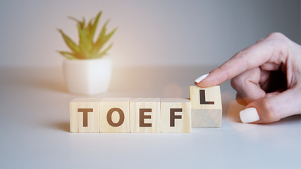 Toefl word concept on cubes, english concept.