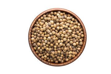 coriander seed spice in wooden bowl, isolated on white background. Seasoning top view