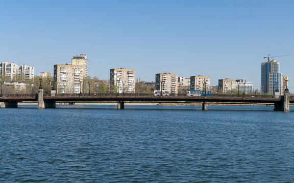 View of the embankment of the Kalmius river and bridge over it in Donetsk. Ukraine. DPR.