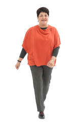 Fototapeta premium Smiling woman walking towards the camera