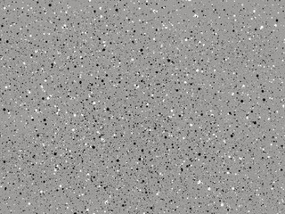 Abstract gray background with small black and white spots