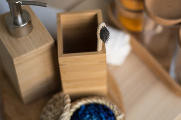 wooden toothbrush in a glass. bath accessories