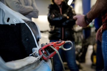 Naklejka na ściany i meble Towing hook, car body repairs in a car workshop