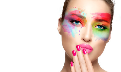 Beautiful model girl with colorful make-up. Fashion makeup and cosmetics concept. Fine art beauty...