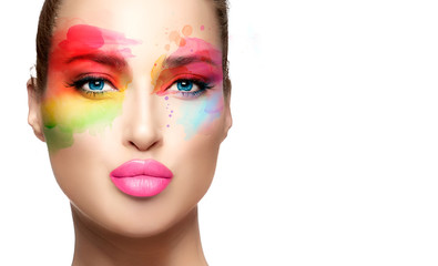 Beautiful model girl with colorful make-up. Fashion makeup and cosmetics concept. Fine art beauty...