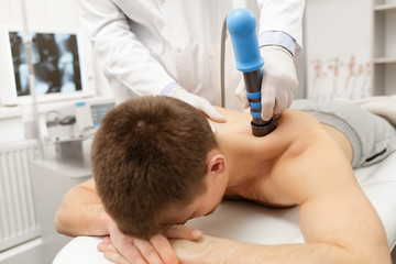 Extracorporeal Shockwave Therapy ESWT.Non-surgical treatment.Physical therapy for neck and back...