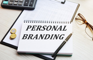 The inscription Work from home. Handwritten text in a notebook on the background of financial...