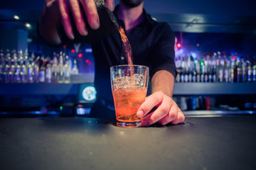 bartender  making  a mixology cocktail mixed drink in a bar  Orlando stock photo royalty free 