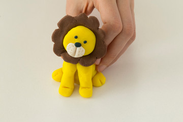 Making lion animal step by step with play dough for children's activity in the school art lesson and plasticine concept.