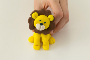 Making lion animal step by step with play dough for children's activity in the school art lesson and plasticine concept.