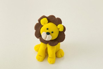 Making lion animal step by step with play dough for children's activity in the school art lesson and plasticine concept.