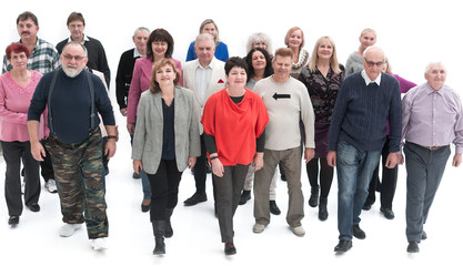 Obraz premium Casual group of people walking isolated over a white background