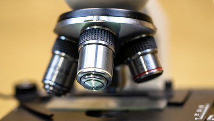 Fototapeta na wymiar Close up of examining of test sample under the microscope in laboratory.