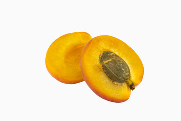 Naklejka na ściany i meble Fresh apricot isolated on white background. One sliced apricot on white
